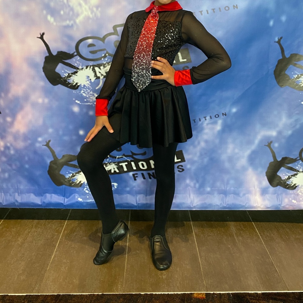 Black and red dance costume. Red tie with Sequins